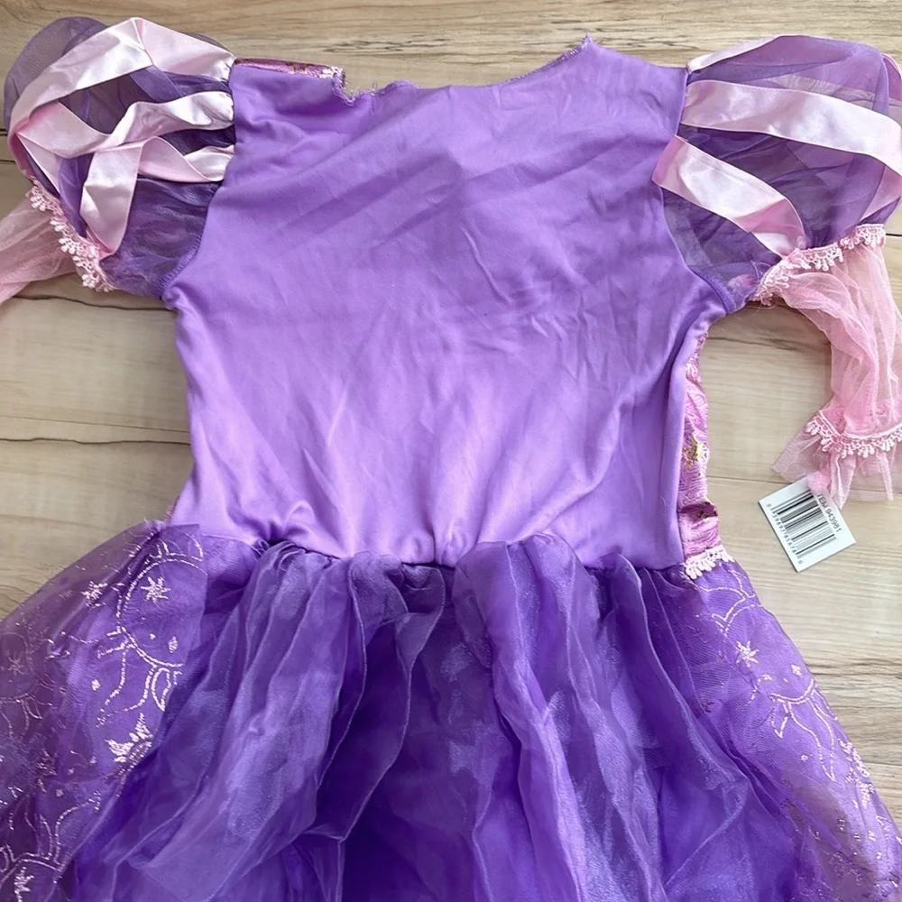 NWT Disney Princess Rapunzel Dress Up Dress. Girls Size M 7/8. Runs long. Pretty